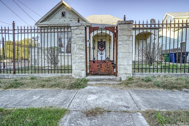 view of gate featuring a fenced front yard