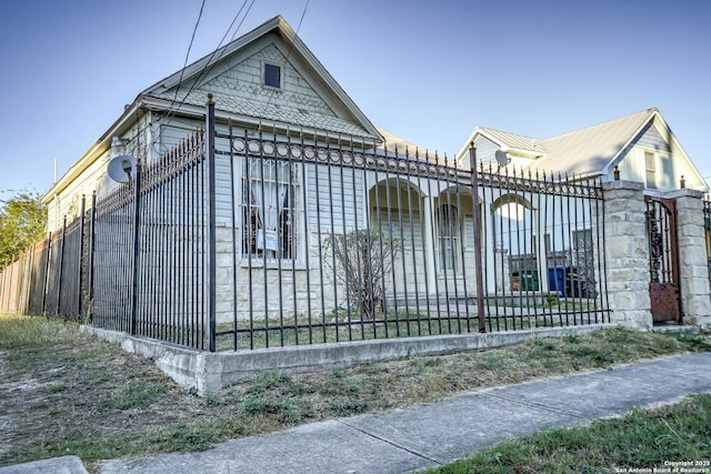 view of gate featuring a fenced front yard