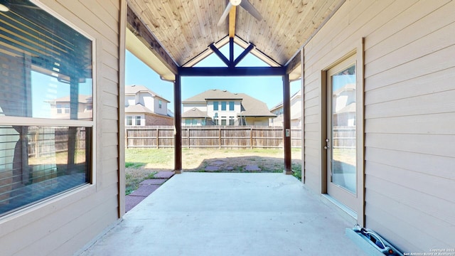 view of patio with a residential view and fence