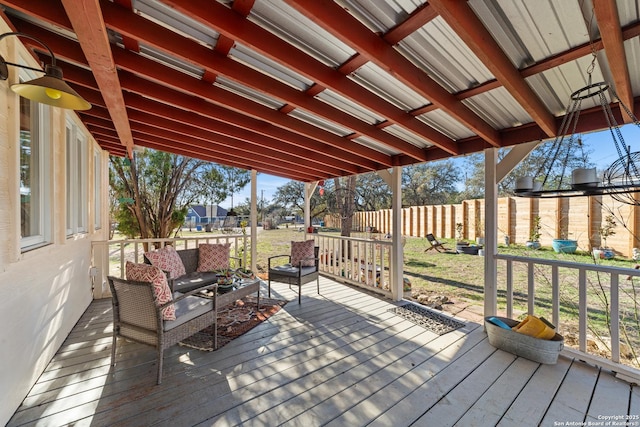 wooden deck with fence and a lawn