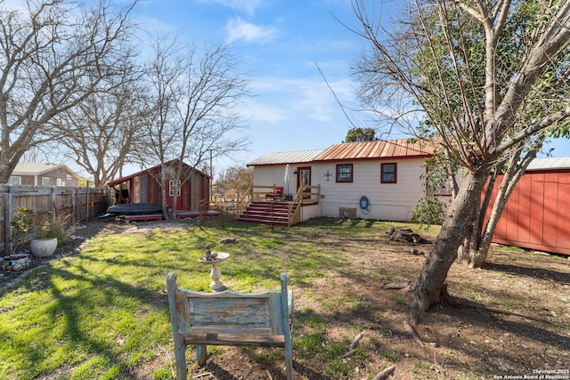 exterior space featuring a shed, an outdoor structure, and a fenced backyard