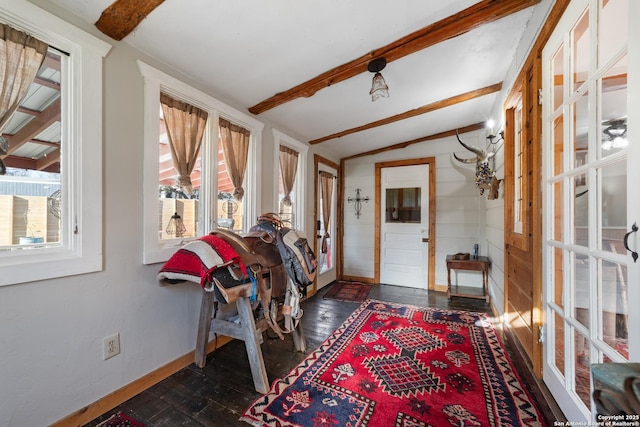 entryway with vaulted ceiling with beams, dark wood-style floors, and baseboards