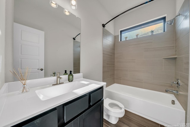 full bathroom with toilet, vanity, and shower / tub combination