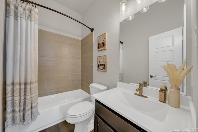 bathroom featuring toilet, shower / bath combo, wood finished floors, and vanity