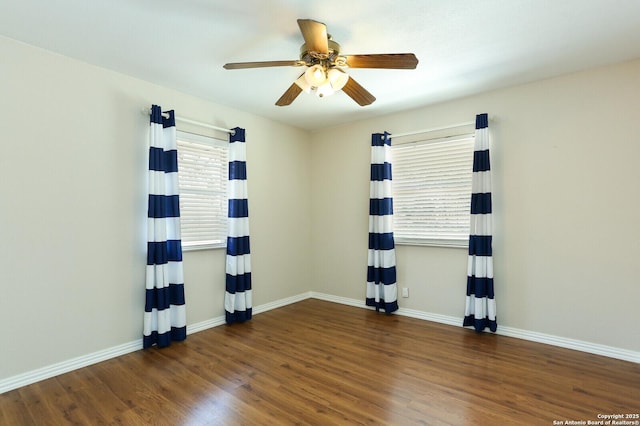 unfurnished room with ceiling fan, baseboards, and wood finished floors