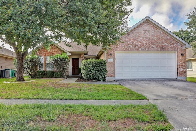 view of front of home with driveway, brick siding, central AC unit, an attached garage, and a front yard