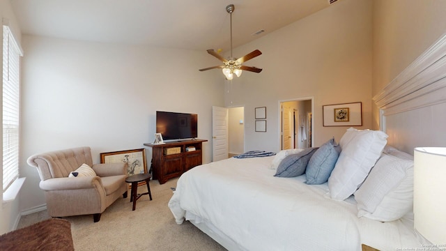 bedroom with light carpet, ceiling fan, visible vents, and high vaulted ceiling