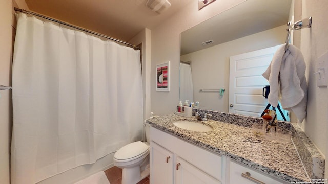 full bath featuring visible vents, vanity, and toilet