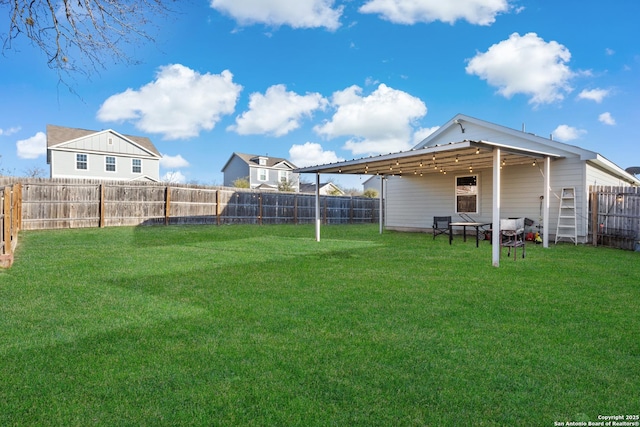 view of yard with a fenced backyard