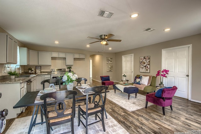 dining room with recessed lighting, visible vents, ceiling fan, and light wood-style flooring