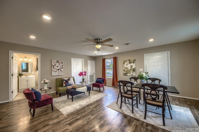 dining space with dark wood-style floors, baseboards, visible vents, and recessed lighting