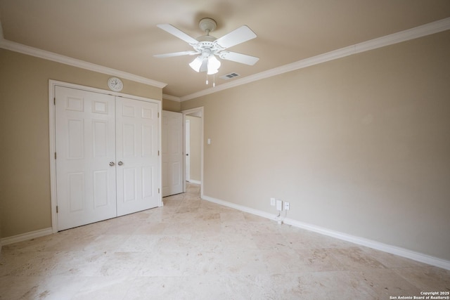 unfurnished bedroom featuring ornamental molding, a closet, visible vents, and baseboards