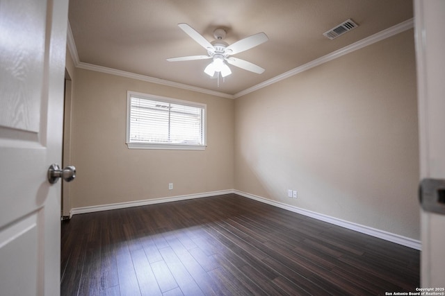 empty room with baseboards, visible vents, a ceiling fan, ornamental molding, and dark wood-type flooring