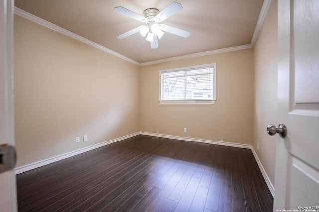 empty room featuring dark wood-style floors, a ceiling fan, baseboards, and crown molding