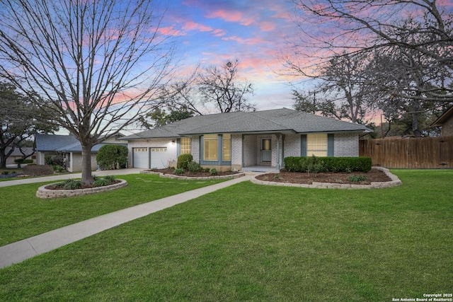 single story home with a garage, driveway, a chimney, fence, and brick siding