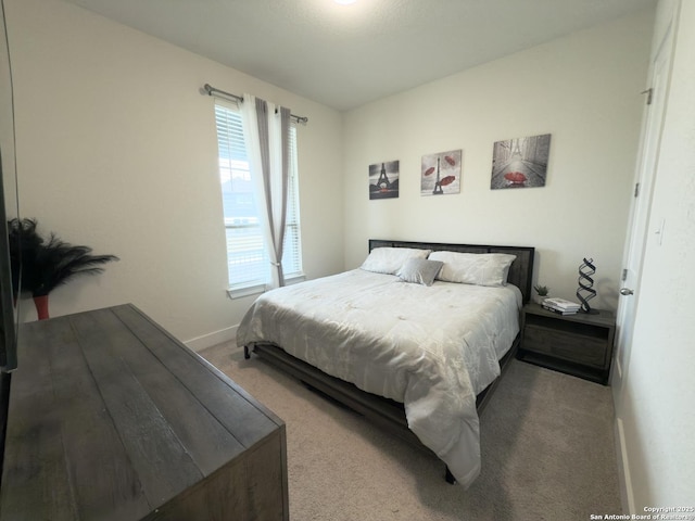 carpeted bedroom with baseboards