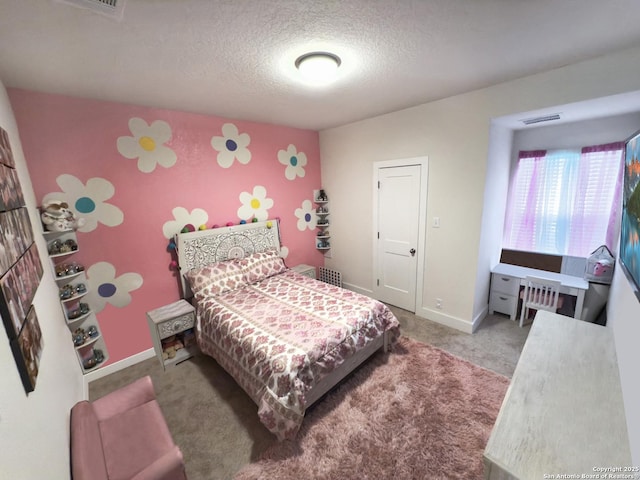 carpeted bedroom featuring visible vents, a textured ceiling, and baseboards