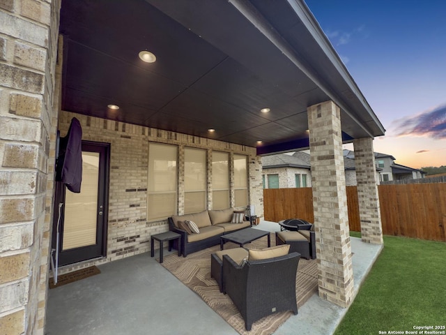 view of patio / terrace featuring fence and an outdoor living space