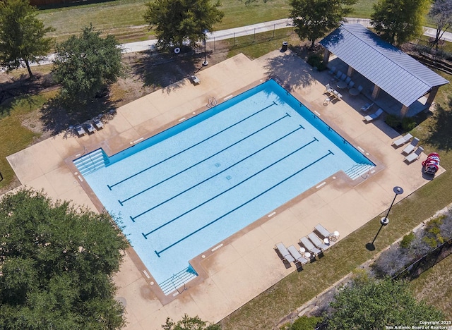 view of pool featuring fence