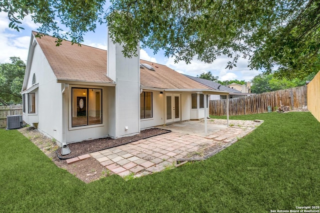 back of house featuring cooling unit, french doors, a fenced backyard, and a patio