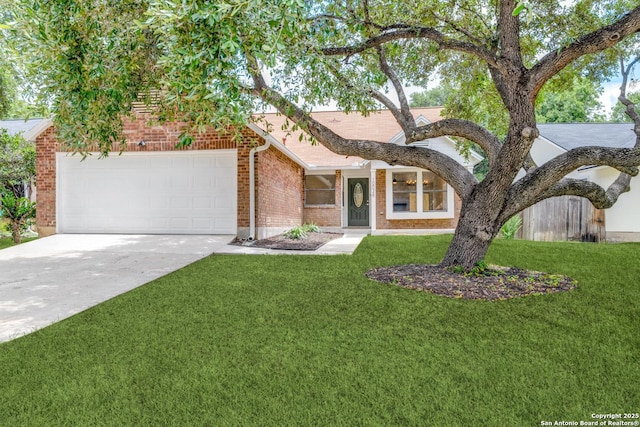 view of front of home with a garage, brick siding, driveway, and a front lawn