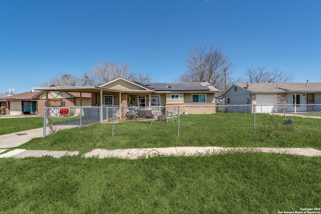 single story home featuring driveway, a front yard, a fenced front yard, roof mounted solar panels, and brick siding