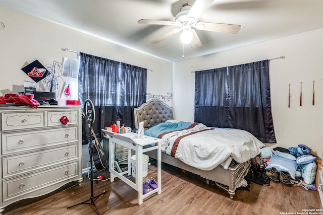 bedroom featuring ceiling fan and wood finished floors