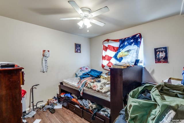 bedroom with wood finished floors and a ceiling fan