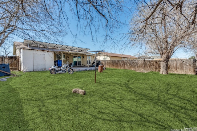 view of yard with a patio and a fenced backyard