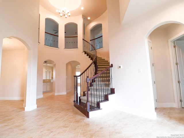 foyer entrance with recessed lighting, baseboards, and light tile patterned floors