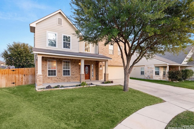 view of front facade featuring brick siding, a porch, concrete driveway, fence, and a front lawn