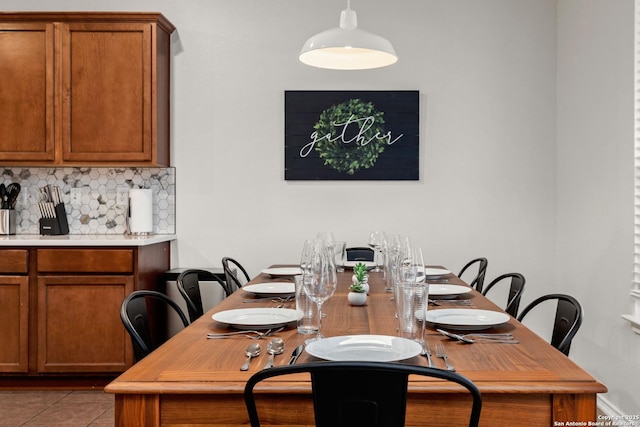 dining space featuring tile patterned flooring