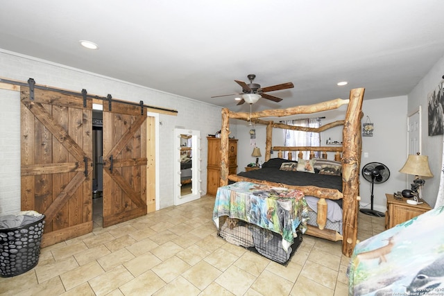 bedroom featuring ceiling fan, a barn door, and recessed lighting