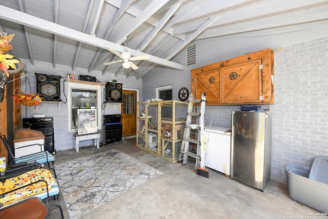 interior space featuring ceiling fan, visible vents, and freestanding refrigerator