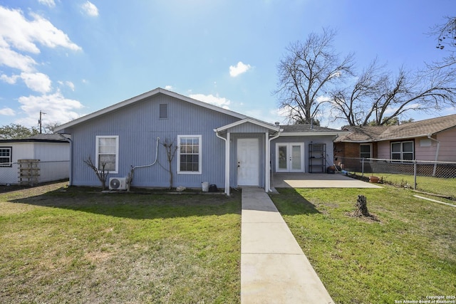 single story home featuring ac unit, a front yard, fence, and french doors