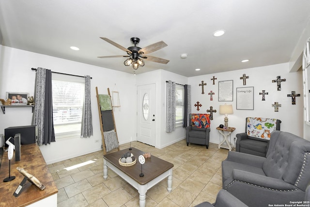 living room featuring light tile patterned floors, baseboards, a ceiling fan, and recessed lighting