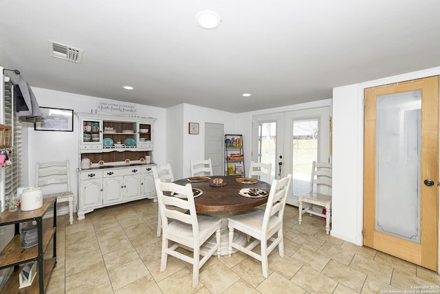 dining area featuring light tile patterned floors, recessed lighting, visible vents, and french doors