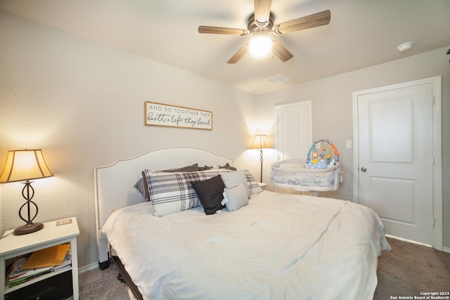 bedroom featuring baseboards, visible vents, ceiling fan, and carpet flooring