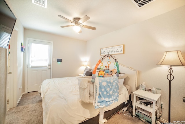 bedroom featuring carpet floors, ceiling fan, and visible vents