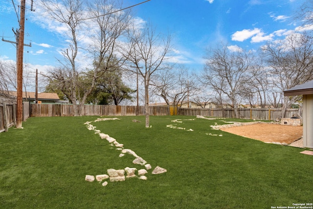 view of yard featuring a fenced backyard