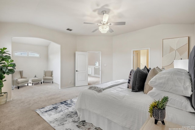 carpeted bedroom with arched walkways, ceiling fan, lofted ceiling, and visible vents