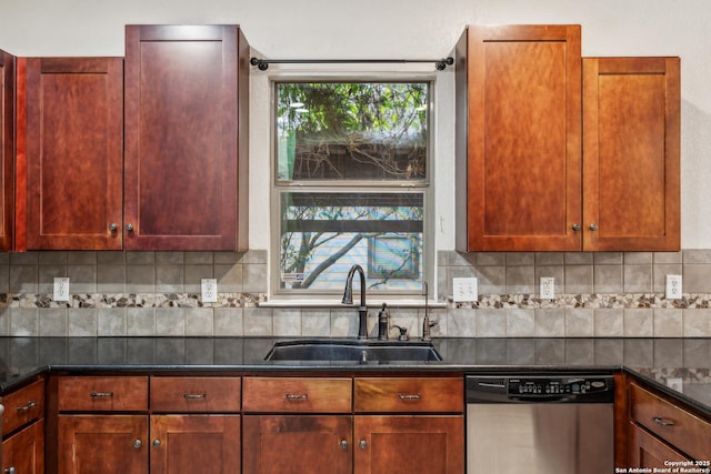 kitchen featuring decorative backsplash, a wealth of natural light, a sink, and stainless steel dishwasher