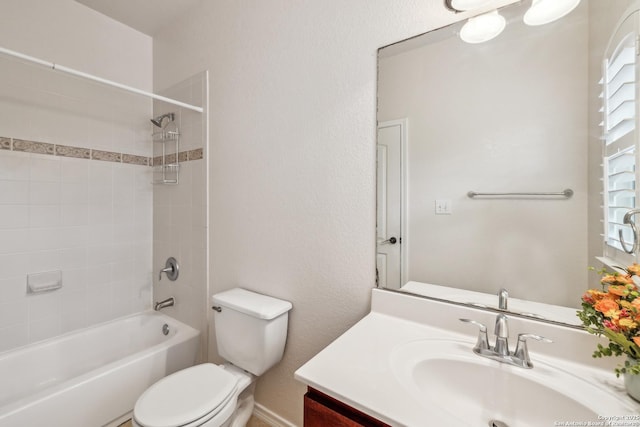 bathroom with  shower combination, vanity, and toilet