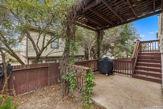 view of yard with fence and a deck