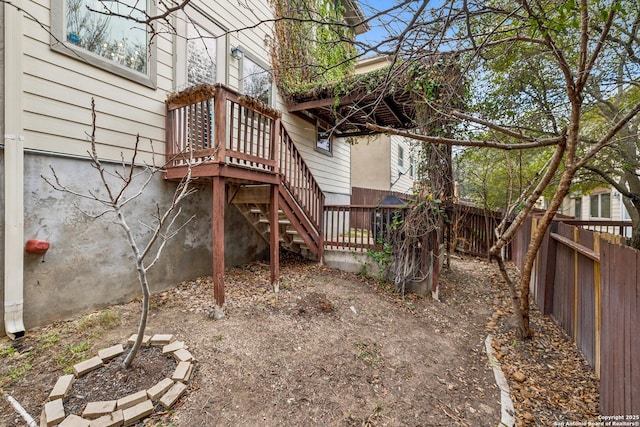 view of yard featuring a deck and a fenced backyard