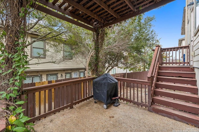 exterior space featuring fence private yard, a grill, and stairs