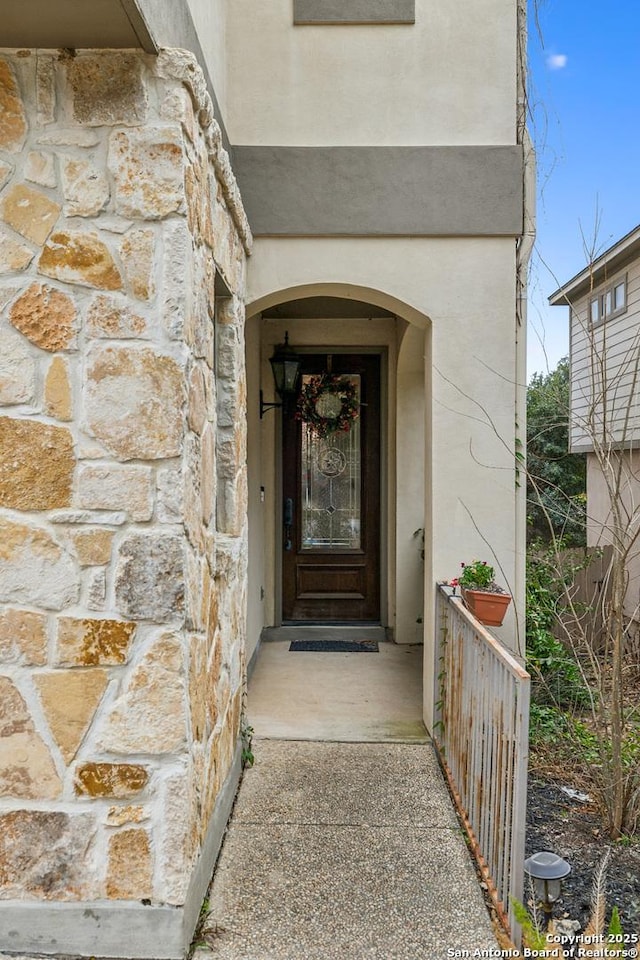 view of exterior entry with stone siding