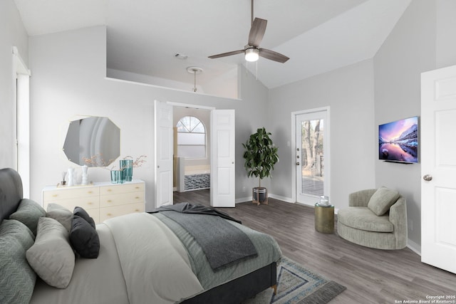 bedroom with ceiling fan, vaulted ceiling, wood finished floors, access to outside, and baseboards