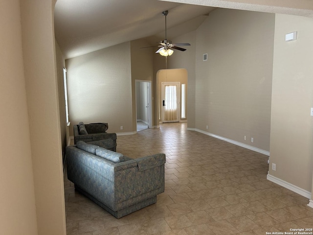 living area featuring high vaulted ceiling, ceiling fan, visible vents, and baseboards