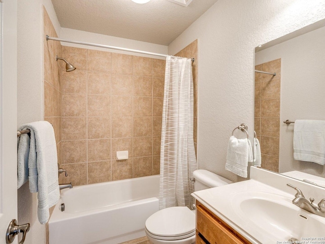 full bathroom with a textured wall, toilet, shower / tub combo with curtain, a textured ceiling, and vanity